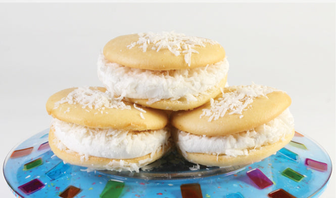 Coconut Wicked Whoopie Pies with coconut cake shells and vanilla filling.